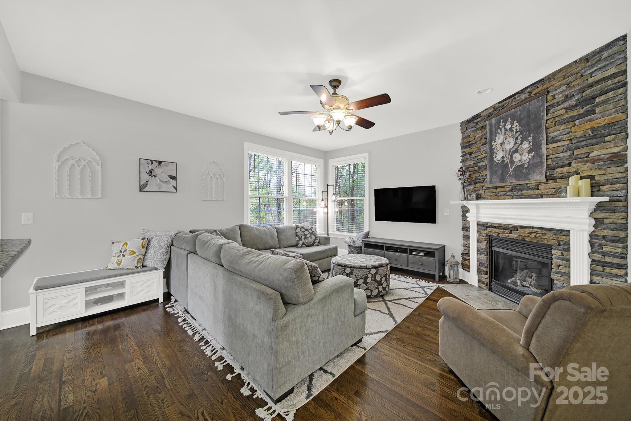 110 Sonnys Way Fort Mill, SC 29708 - Photo 12 of 48 a living room with furniture wooden floor and a flat screen tv