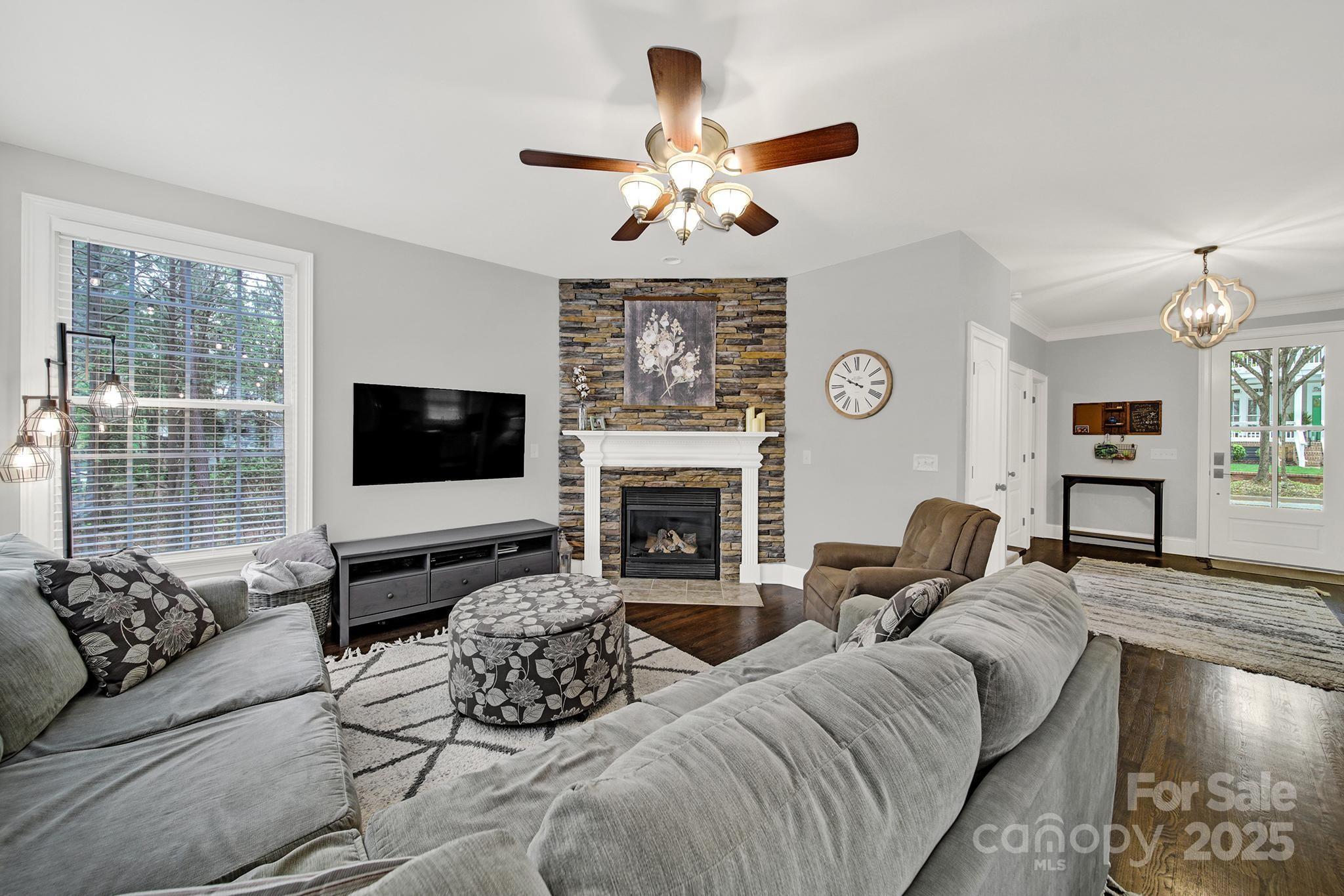 110 Sonnys Way Fort Mill, SC 29708 - Photo 13 of 48 a living room with furniture a fireplace and a flat screen tv