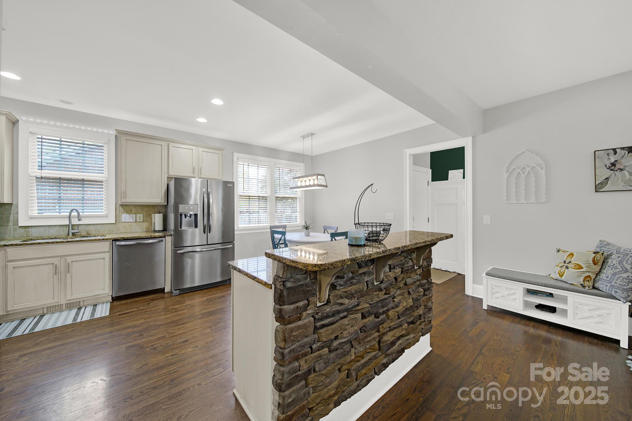 110 Sonnys Way Fort Mill, SC 29708 - Photo 15 of 48 a kitchen with stainless steel appliances a sink a stove a refrigerator and cabinets
