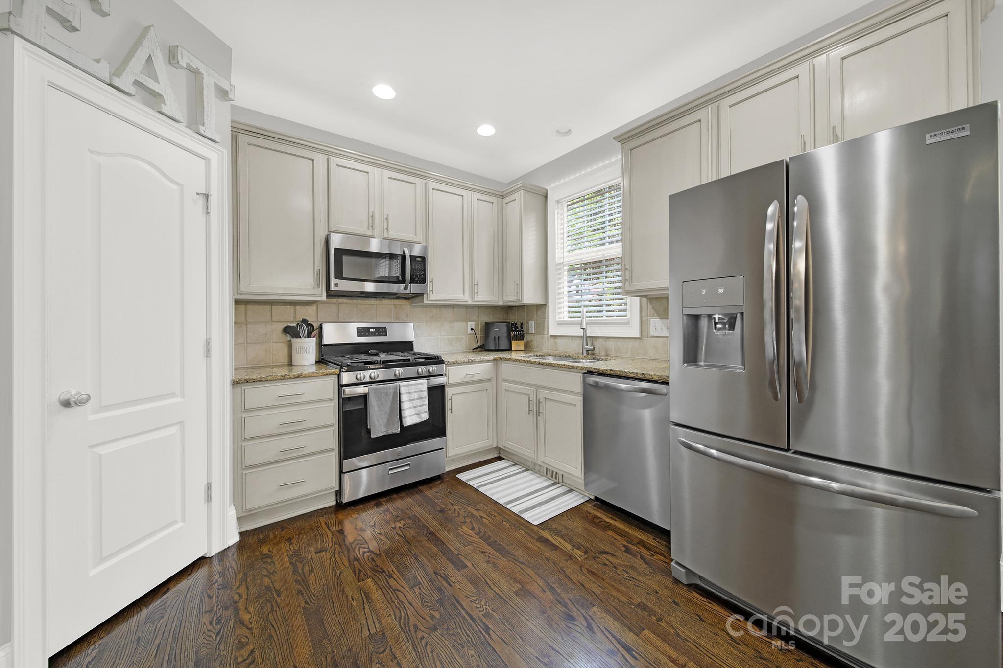 110 Sonnys Way Fort Mill, SC 29708 - Photo 18 of 48 a kitchen with a refrigerator stove and microwave