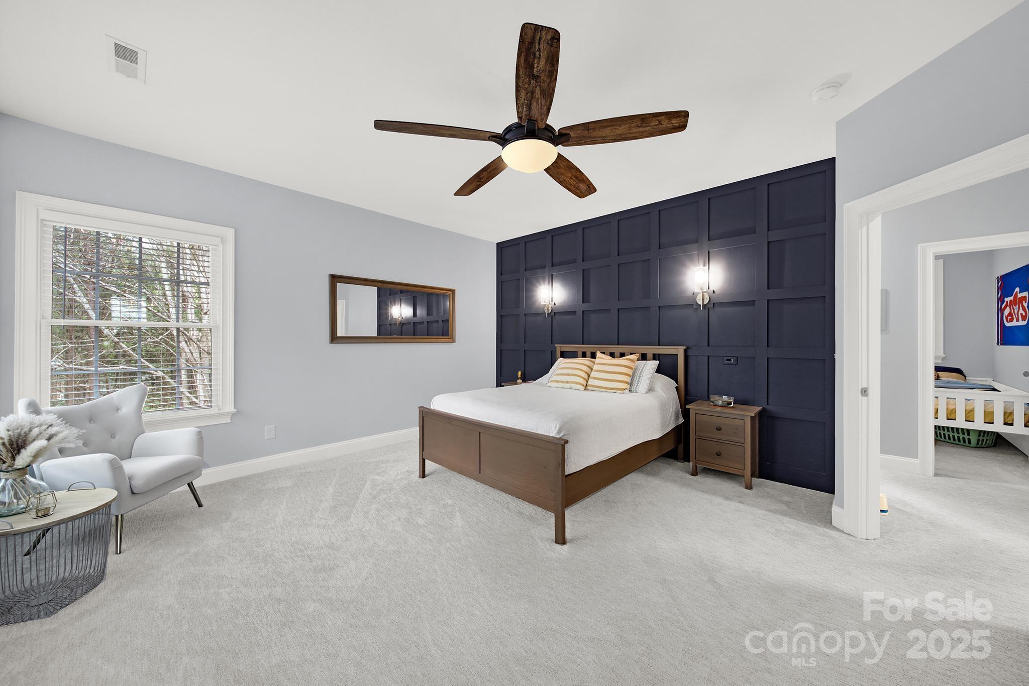 110 Sonnys Way Fort Mill, SC 29708 - Photo 27 of 48 a spacious bedroom with a bed and furniture