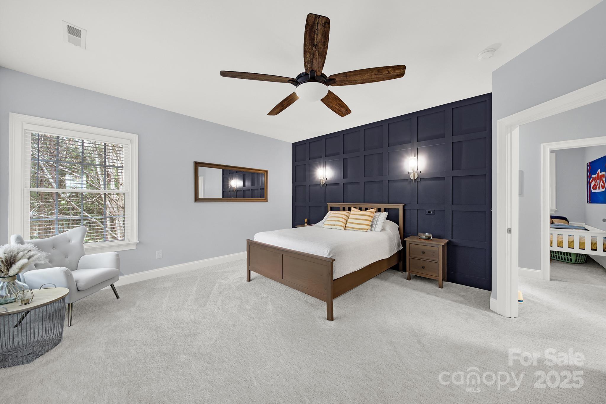 110 Sonnys Way Fort Mill, SC 29708 - Photo 28 of 48 a spacious bedroom with a bed and furniture