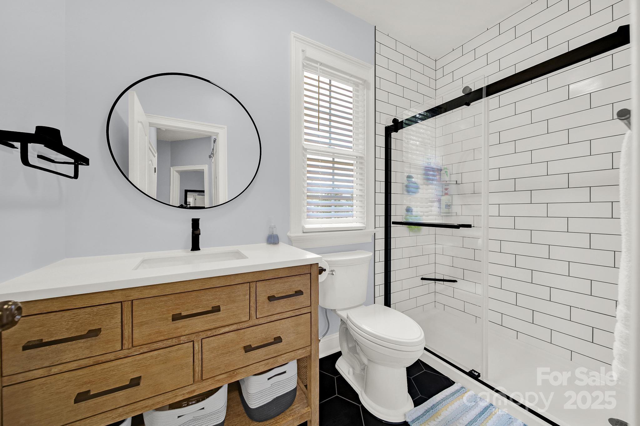 110 Sonnys Way Fort Mill, SC 29708 - Photo 36 of 48 a bathroom with a toilet sink and mirror