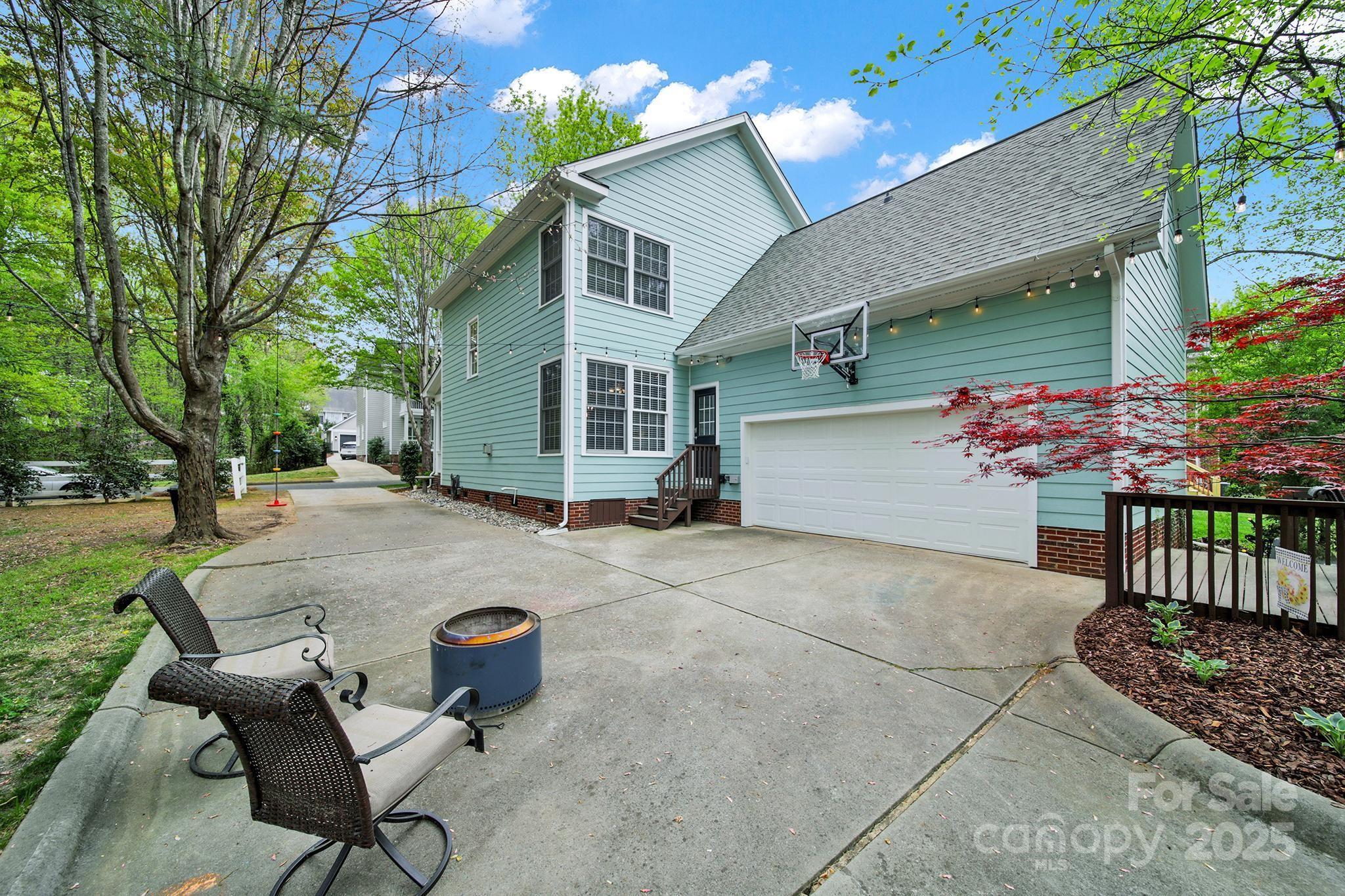 110 Sonnys Way Fort Mill, SC 29708 - Photo 40 of 48 a backyard of a house with table and chairs
