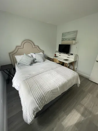 a bathroom with a toilet sink and shower