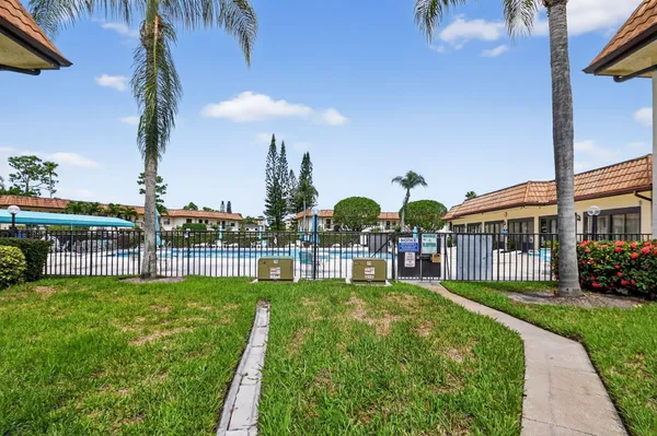 a view of a dining room with furniture and a chandelier