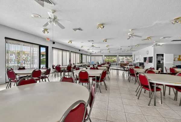 a view of swimming pool with outdoor seating and a patio