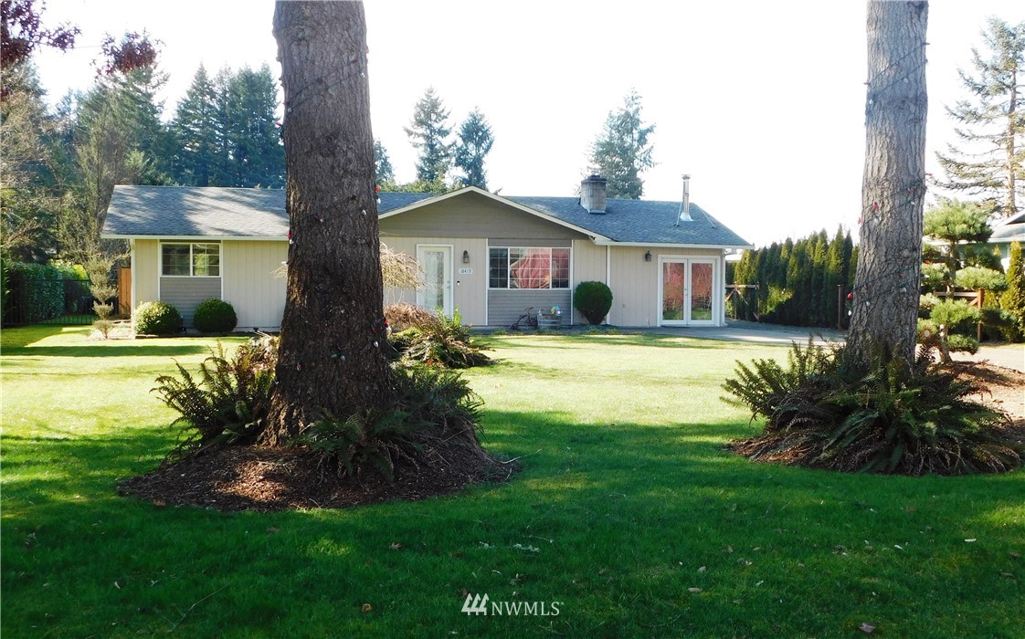 18419 Nutmeg Street Southwest Rochester, WA 98579 - Photo 1 of 24 a view of house with a big yard and potted plants