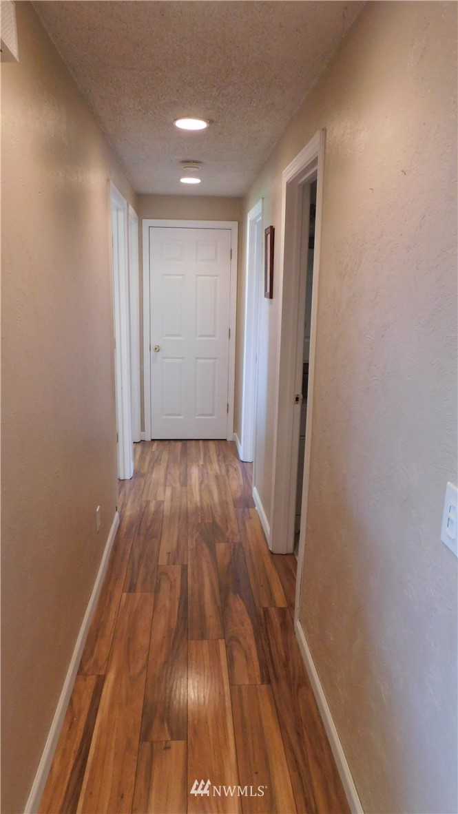 18419 Nutmeg Street Southwest Rochester, WA 98579 - Photo 11 of 24 a view of a room with wooden floor and staircase