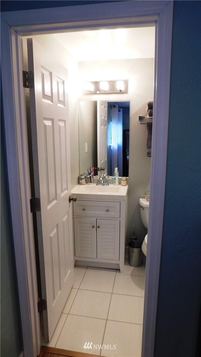 18419 Nutmeg Street Southwest Rochester, WA 98579 - Photo 15 of 24 a bathroom with a sink a toilet and a mirror
