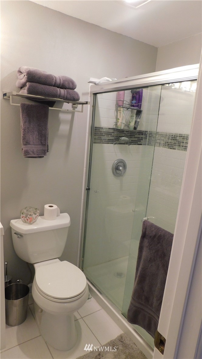 18419 Nutmeg Street Southwest Rochester, WA 98579 - Photo 16 of 24 a bathroom with a shower and a toilet