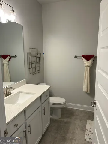 a kitchen with a sink and a stove top oven