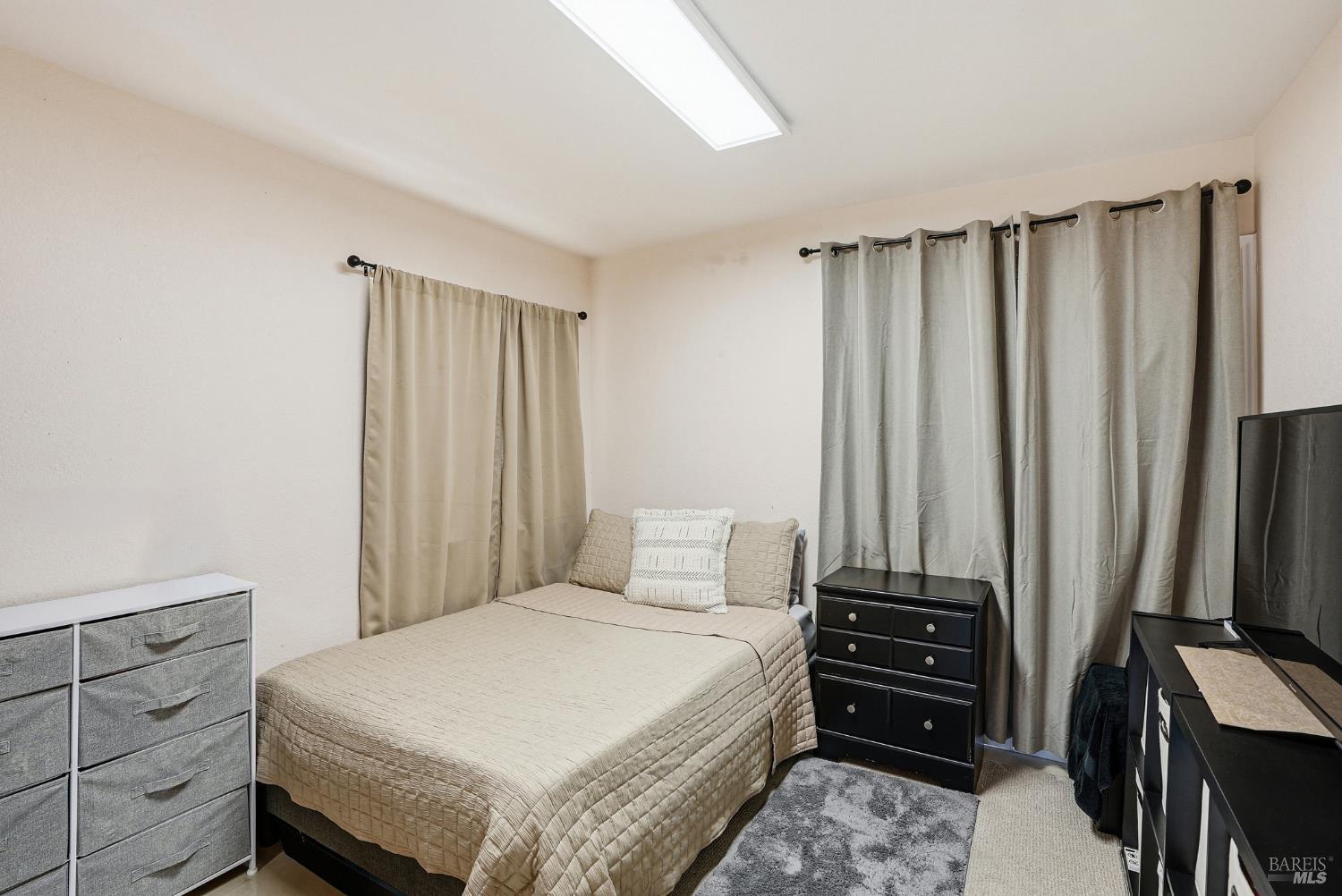 773 Blue Ridge Lane Vacaville, CA 95688 - Photo 24 of 44 a bedroom with a bed and a dresser