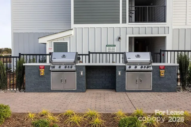 a front view of a house with outdoor seating
