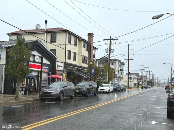 a view of a street with cars