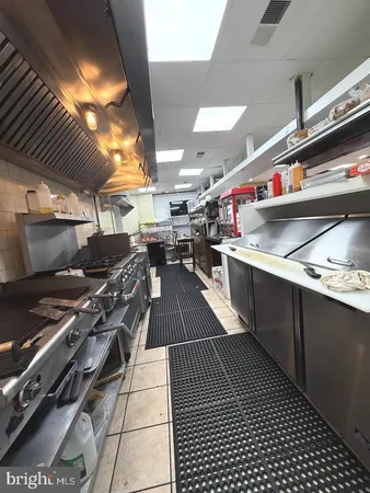 a kitchen with lots of appliances