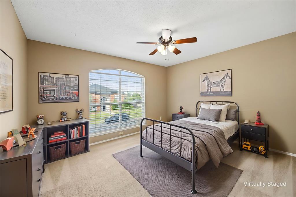 584 Pendleton Drive Rockwall, TX 75032 - Photo 17 of 28 a bedroom with a bed furniture and a window