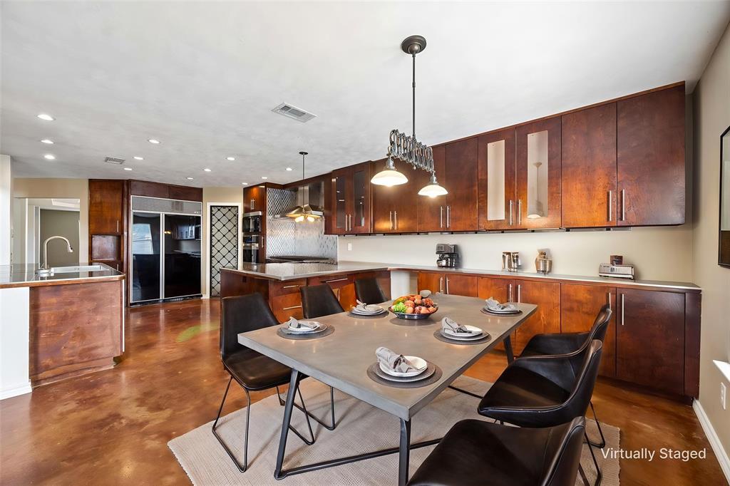 584 Pendleton Drive Rockwall, TX 75032 - Photo 2 of 28 a view of a dining room and livingroom with furniture wooden floor a chandelier