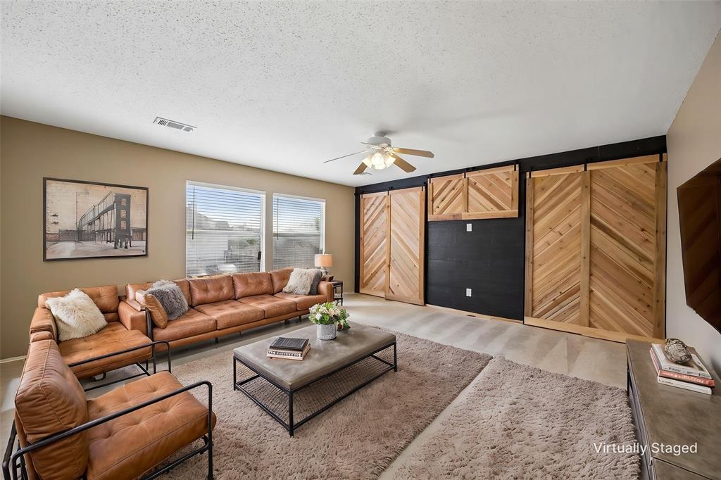 584 Pendleton Drive Rockwall, TX 75032 - Photo 21 of 28 a living room with furniture and a large window