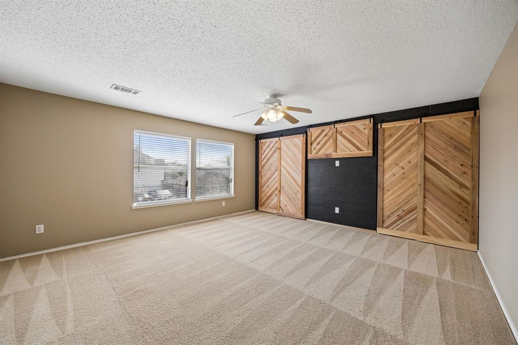 584 Pendleton Drive Rockwall, TX 75032 - Photo 22 of 28 a view of an empty room with a window