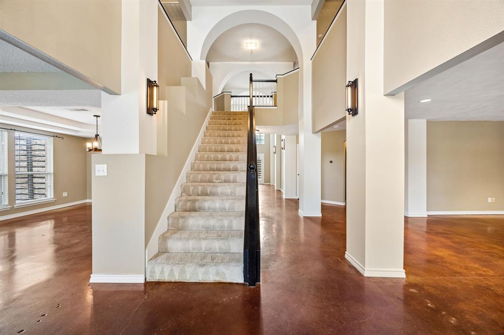 584 Pendleton Drive Rockwall, TX 75032 - Photo 5 of 28 a view of a hallway with wooden floor and staircase
