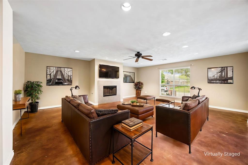 584 Pendleton Drive Rockwall, TX 75032 - Photo 8 of 28 a living room with furniture and a flat screen tv