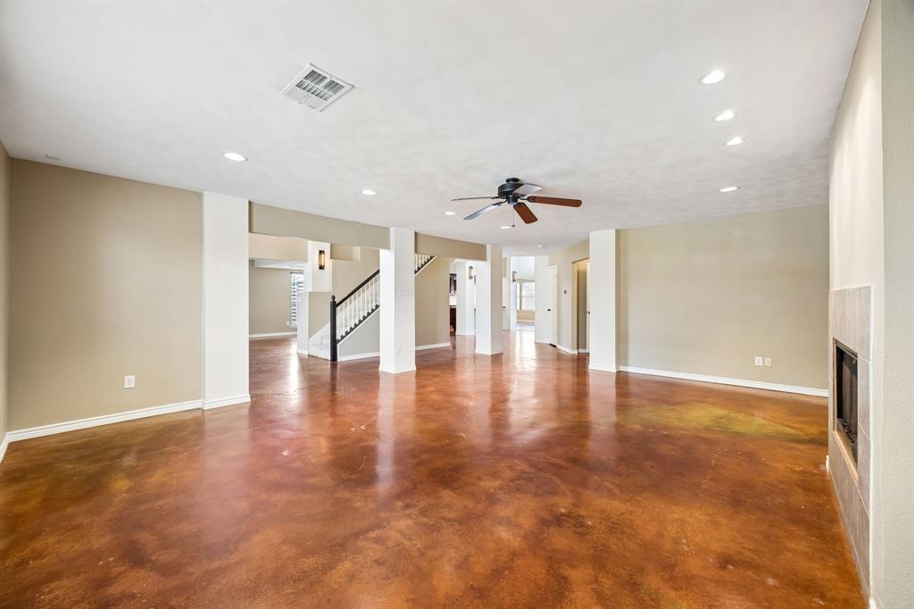 584 Pendleton Drive Rockwall, TX 75032 - Photo 9 of 28 a view of a hallway with wooden floor and chandelier