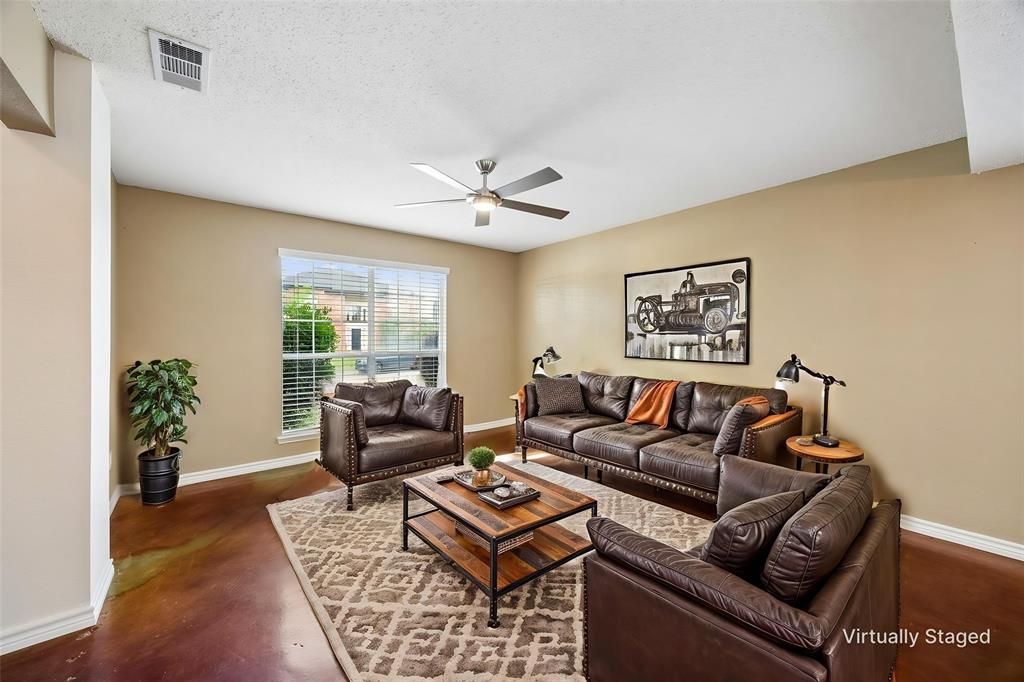 584 Pendleton Drive Rockwall, TX 75032 - Photo 10 of 28 a living room with furniture and a large window with wooden floor