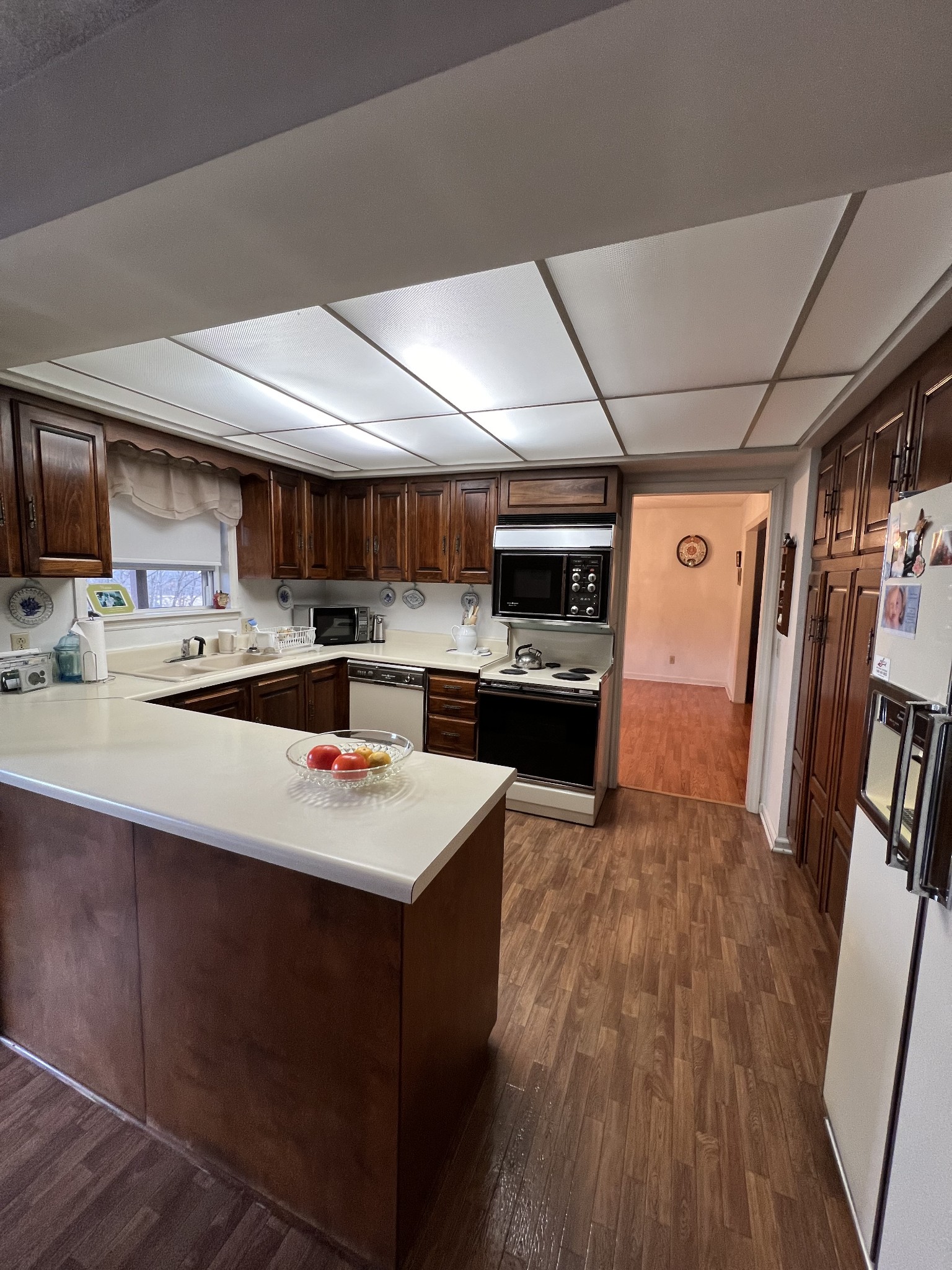 4555 Gamaliel Road Red Boiling Springs, TN 37150 - Photo 4 of 25 a kitchen with stainless steel appliances a sink a stove a refrigerator cabinets and a counter top space