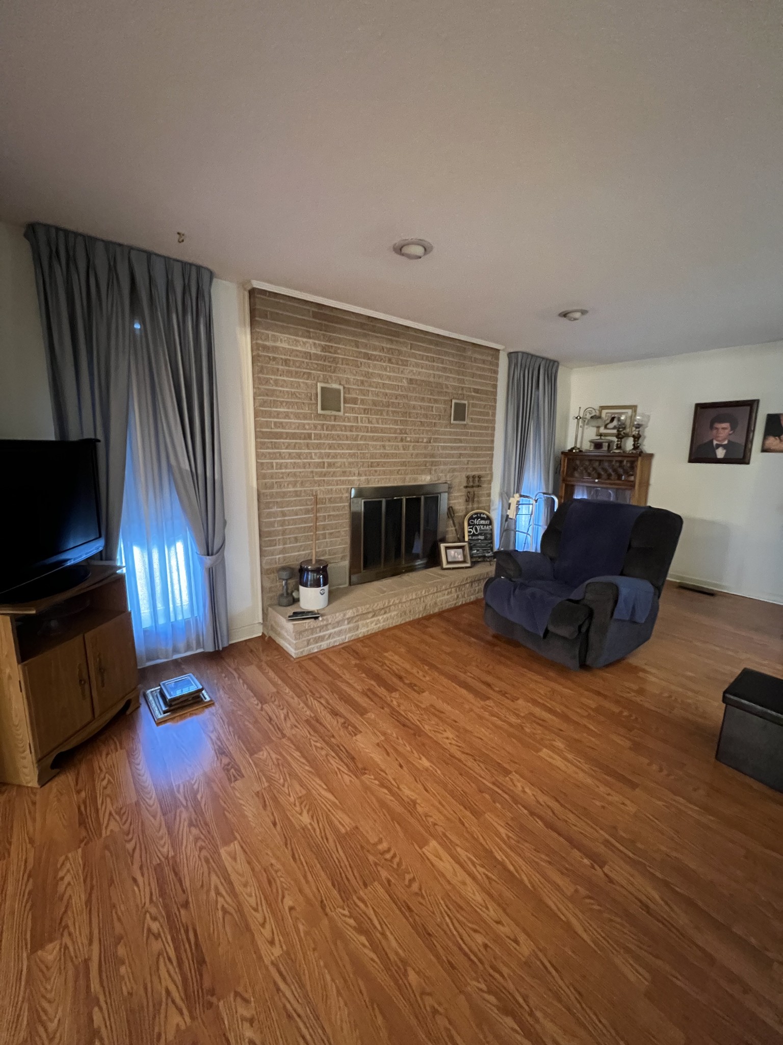 4555 Gamaliel Road Red Boiling Springs, TN 37150 - Photo 7 of 25 a living room with furniture flat screen tv and a fireplace