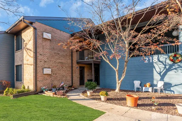 a front view of a house with garden