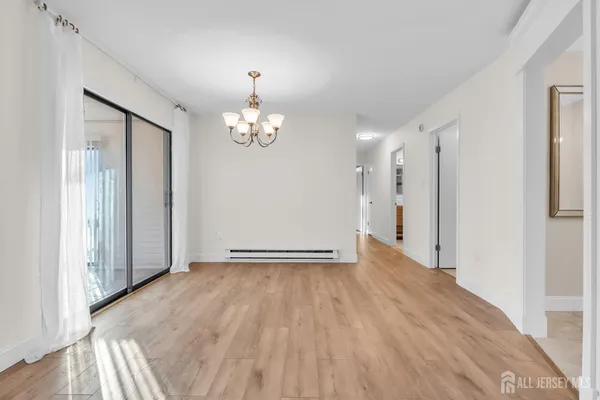 a view of livingroom with hardwood floor and hallway
