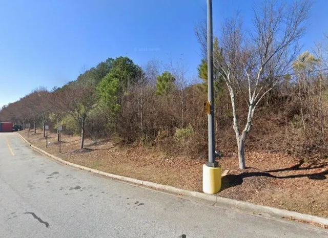 a sign broad on the side of a street