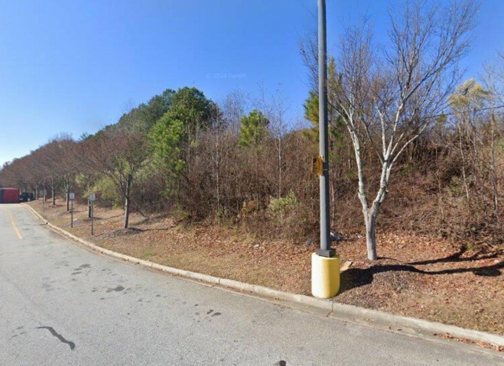 2716 Hamilton Mill Road Buford, GA 30519 - Photo 3 of 5 a view of a road with a house in the background
