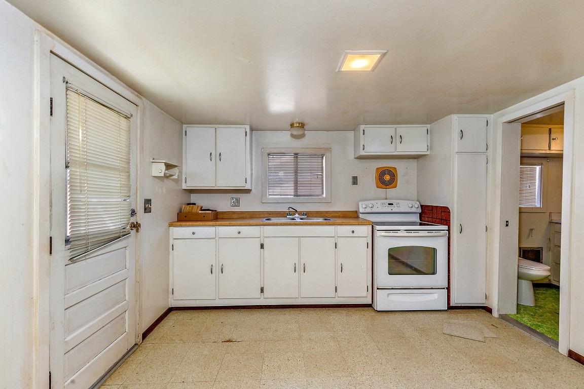 2384 Camp Baker Road Medford, OR 97501 - Photo 23 of 35 a kitchen with cabinets and stainless steel appliances