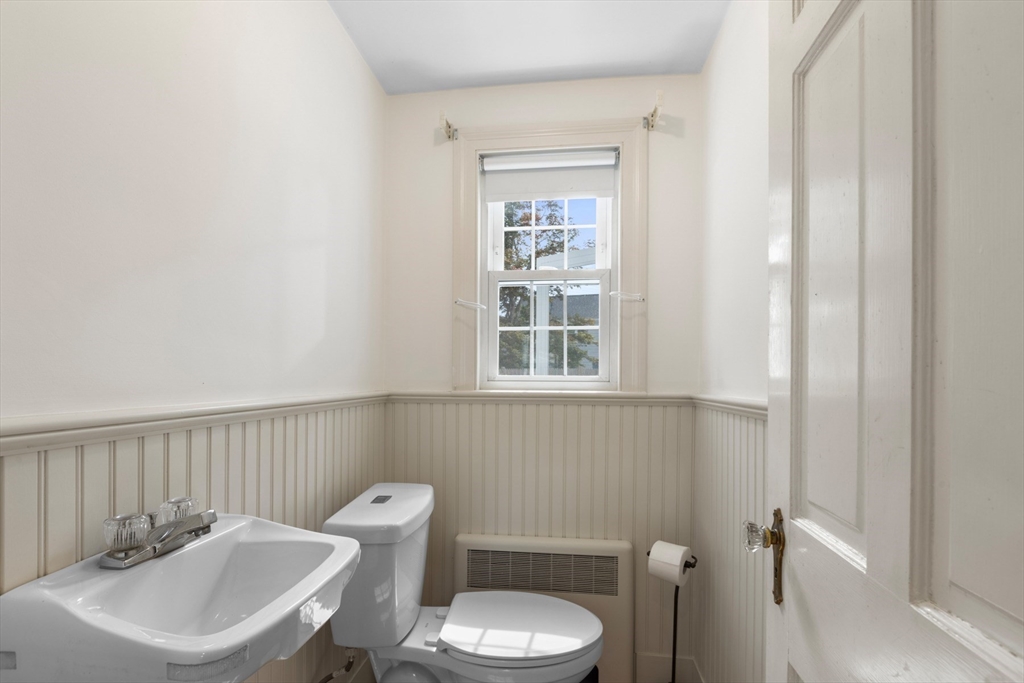 5 Sunset Road Salem, MA 01970 - Photo 14 of 32 a bathroom with a sink a toilet and a window
