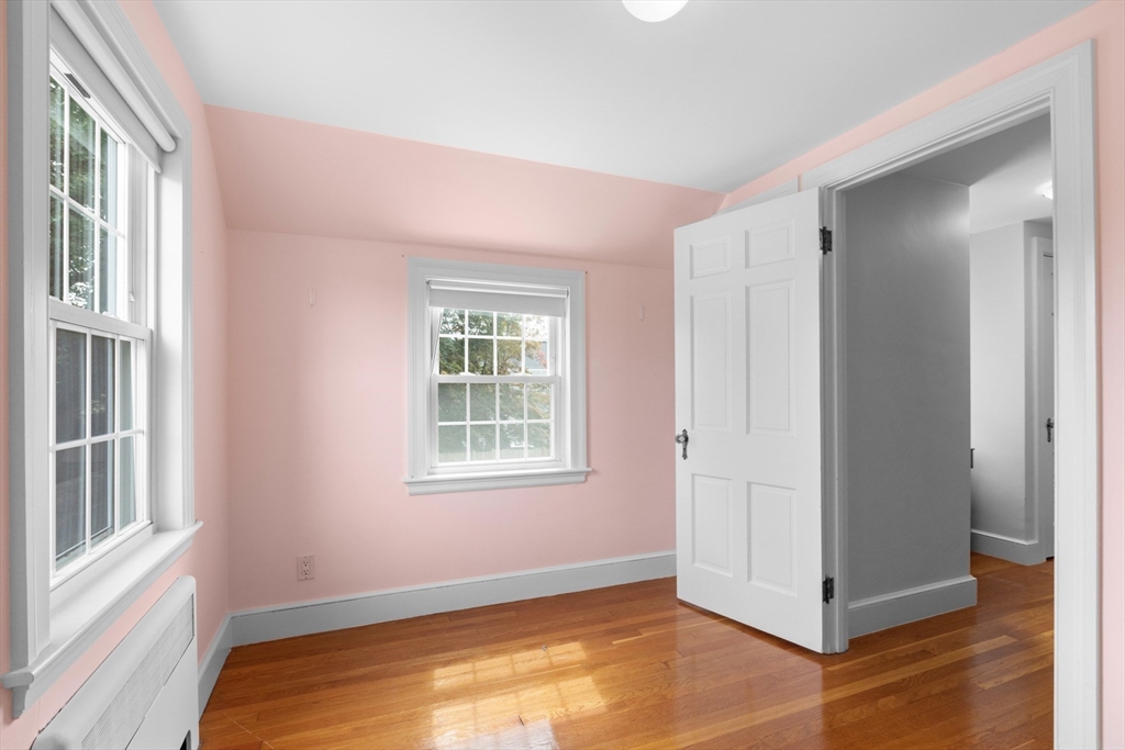 5 Sunset Road Salem, MA 01970 - Photo 17 of 32 a view of an empty room with wooden floor and a window