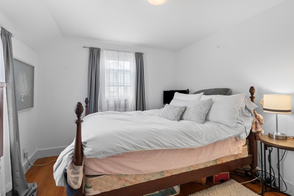 5 Sunset Road Salem, MA 01970 - Photo 20 of 32 a bedroom with a bed and wooden floor