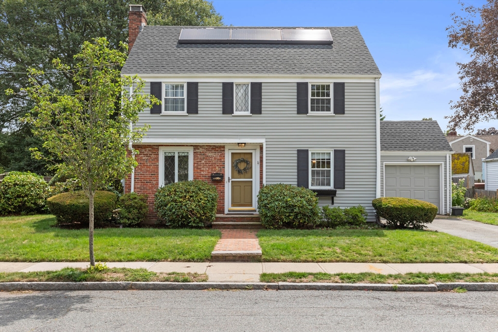 5 Sunset Road Salem, MA 01970 - Photo 2 of 32 a front view of a house with a yard and plants