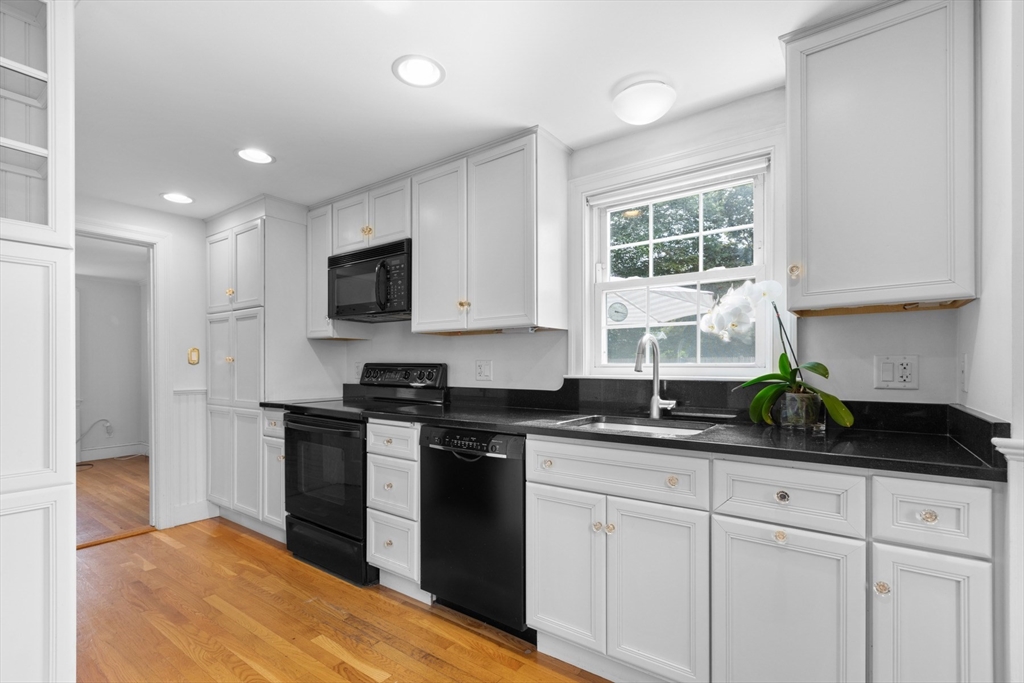 5 Sunset Road Salem, MA 01970 - Photo 6 of 32 a kitchen with a sink stove and refrigerator