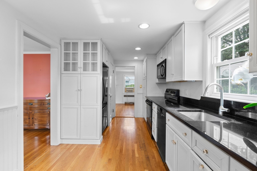 5 Sunset Road Salem, MA 01970 - Photo 7 of 32 a kitchen with granite countertop a stove a sink and a refrigerator