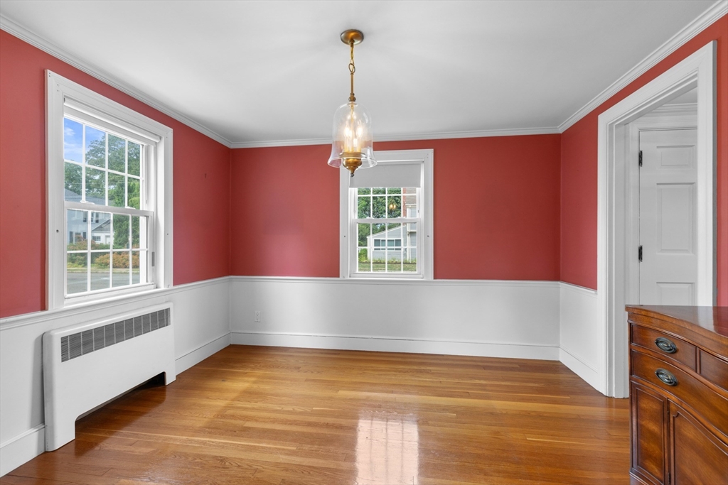 5 Sunset Road Salem, MA 01970 - Photo 10 of 32 a view of an empty room with wooden floor and a window