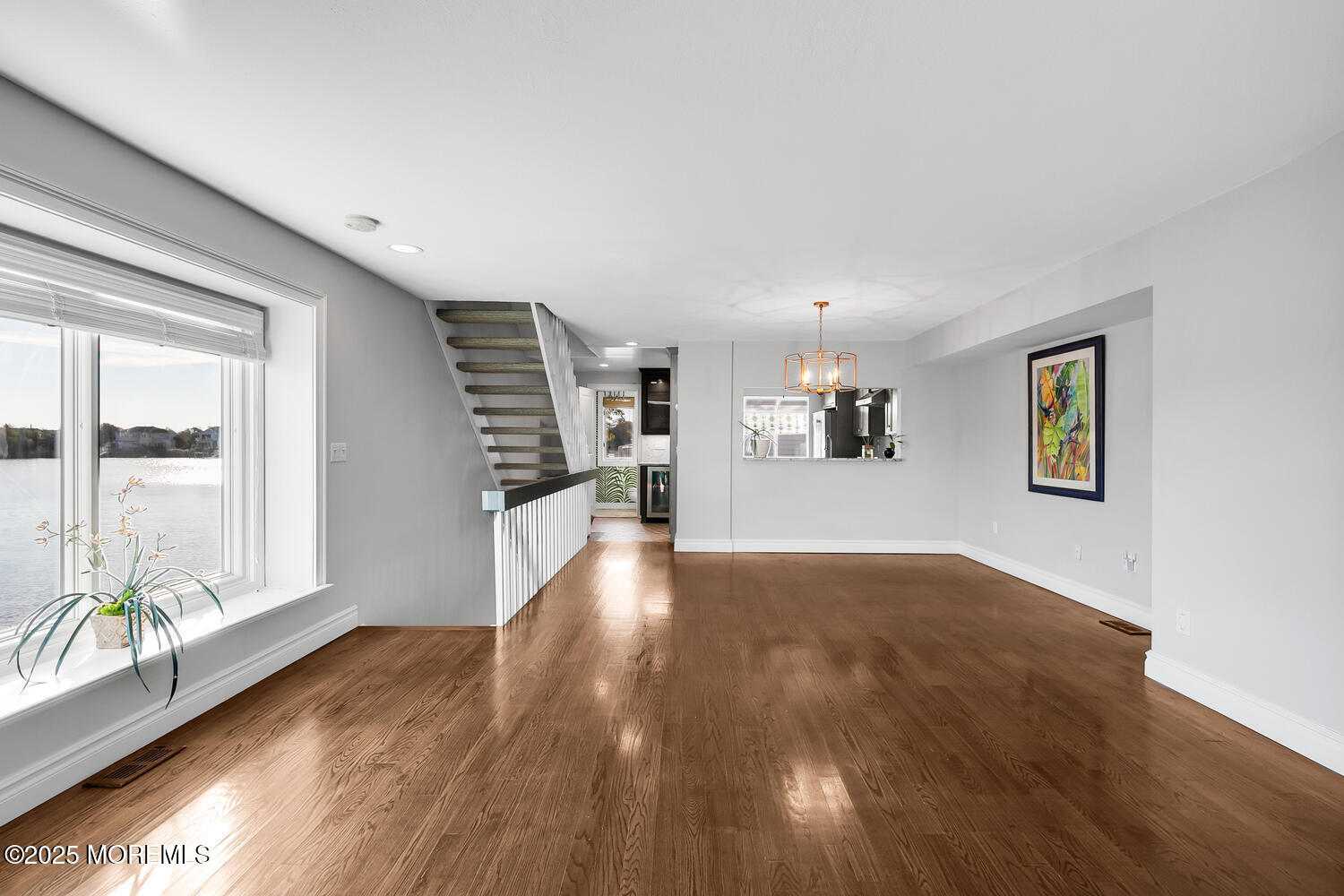 165 Riddle Avenue, Unit 7 Long Branch, NJ 07740 - Photo 19 of 87 a view of a living room with wooden floor and a large window