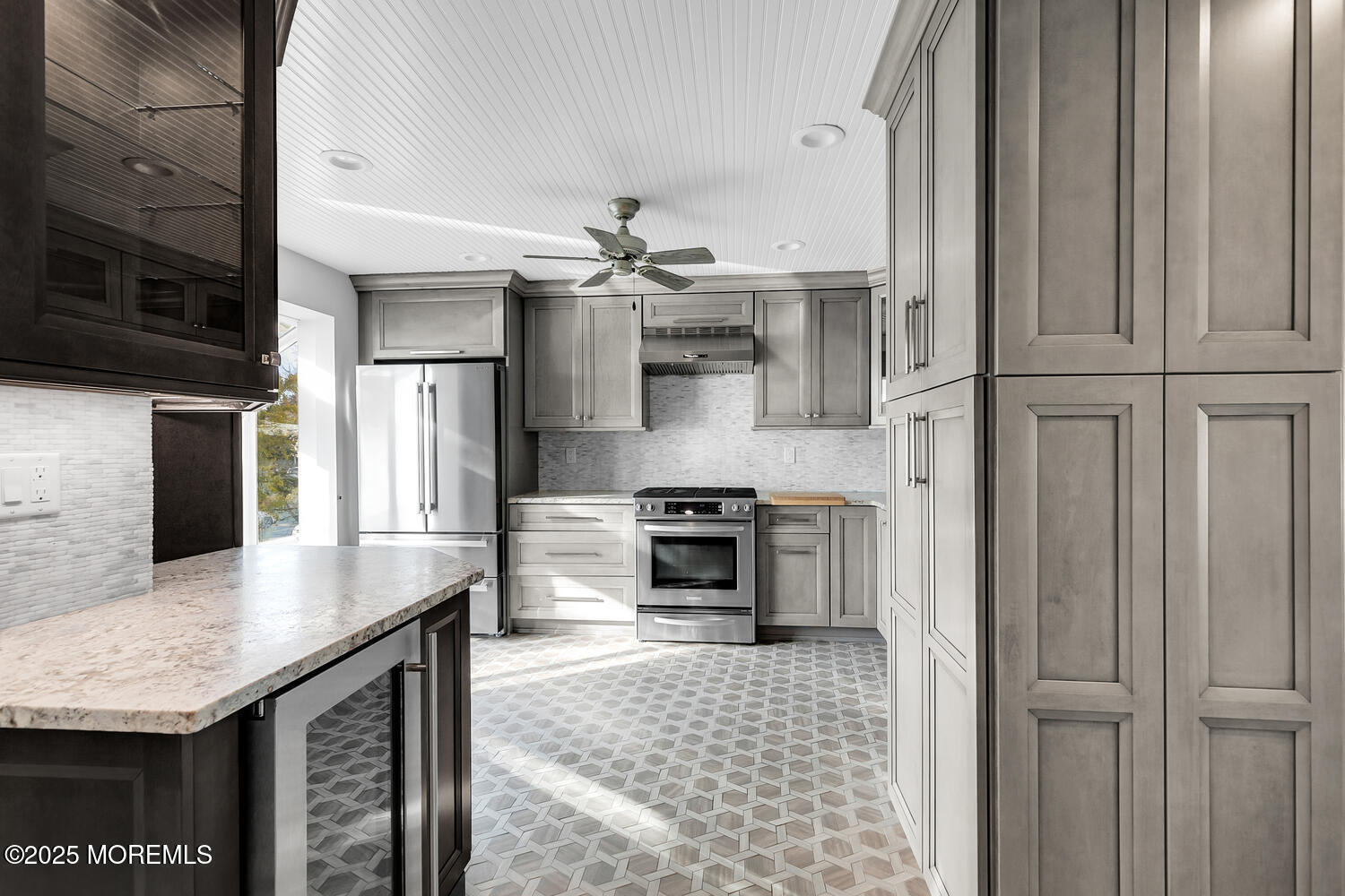 165 Riddle Avenue, Unit 7 Long Branch, NJ 07740 - Photo 23 of 87 a kitchen with stainless steel appliances granite countertop a stove and a refrigerator