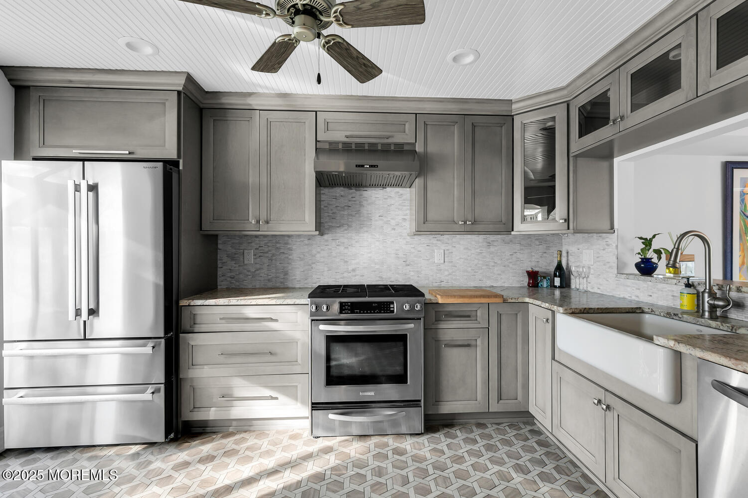 165 Riddle Avenue, Unit 7 Long Branch, NJ 07740 - Photo 24 of 87 a kitchen with stainless steel appliances a stove sink and refrigerator