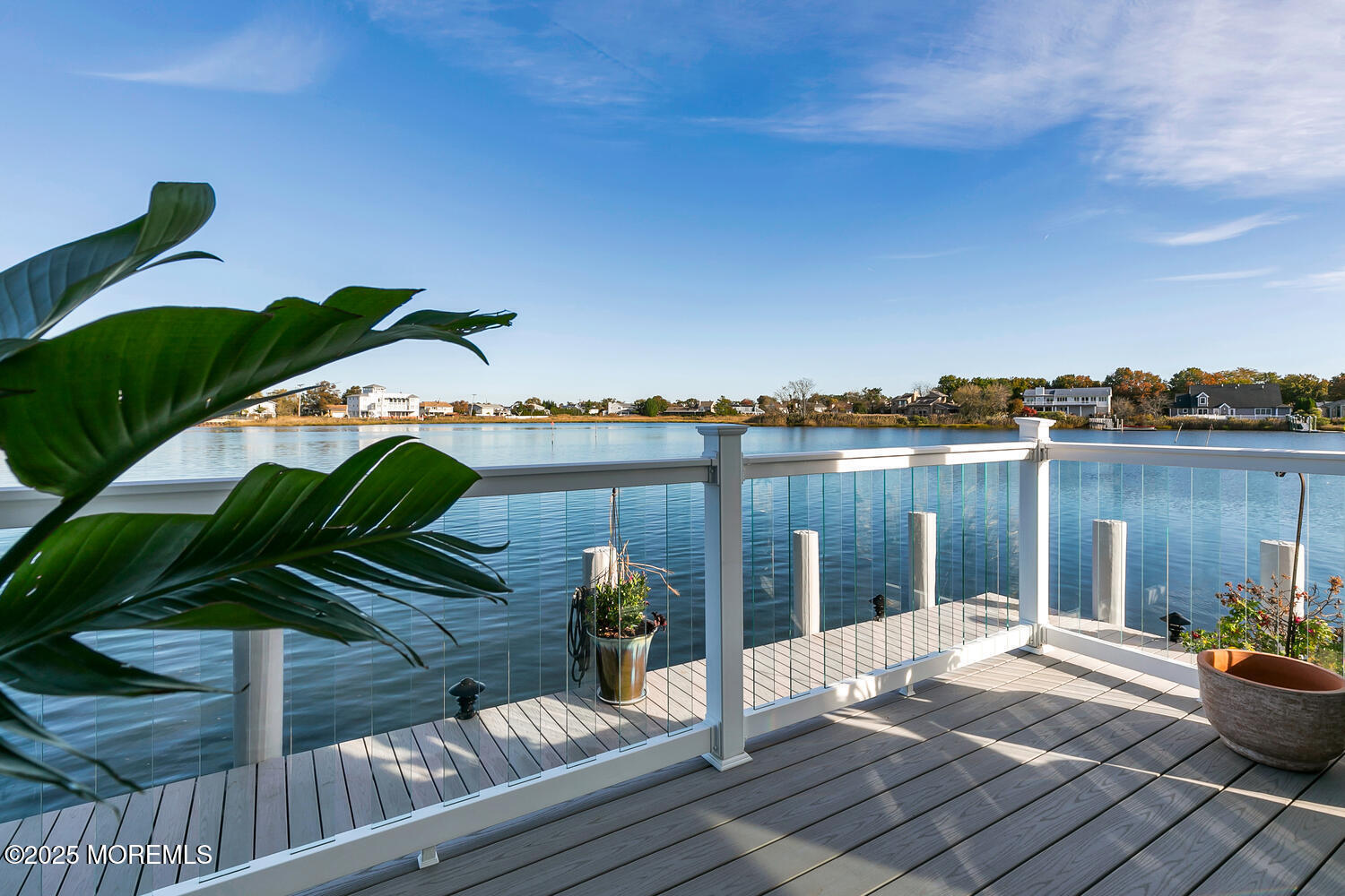 165 Riddle Avenue, Unit 7 Long Branch, NJ 07740 - Photo 45 of 87 a view of a balcony with lake view and wooden floor