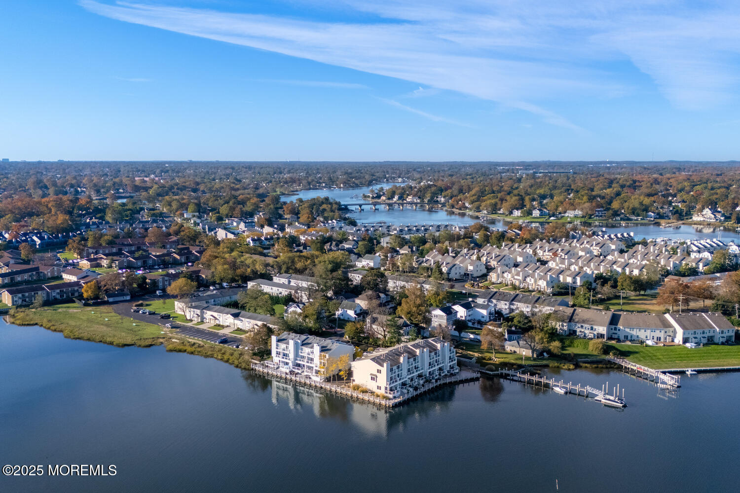 165 Riddle Avenue, Unit 7 Long Branch, NJ 07740 - Photo 61 of 87 an aerial view of a city with lots of residential buildings ocean and mountain view in back