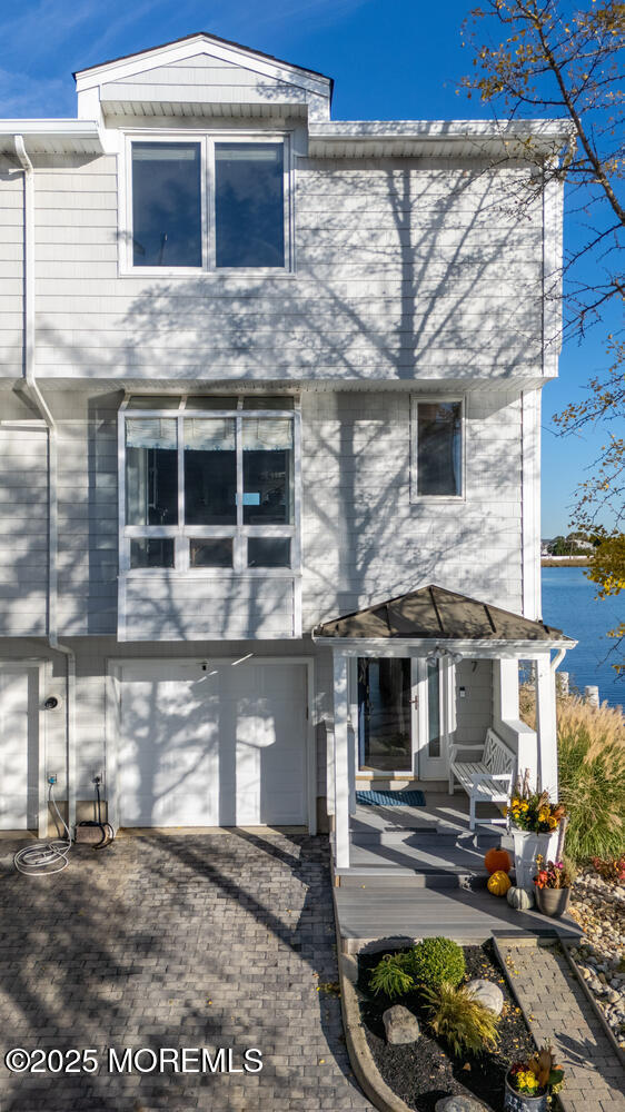 165 Riddle Avenue, Unit 7 Long Branch, NJ 07740 - Photo 65 of 87 a front view of a house with garden