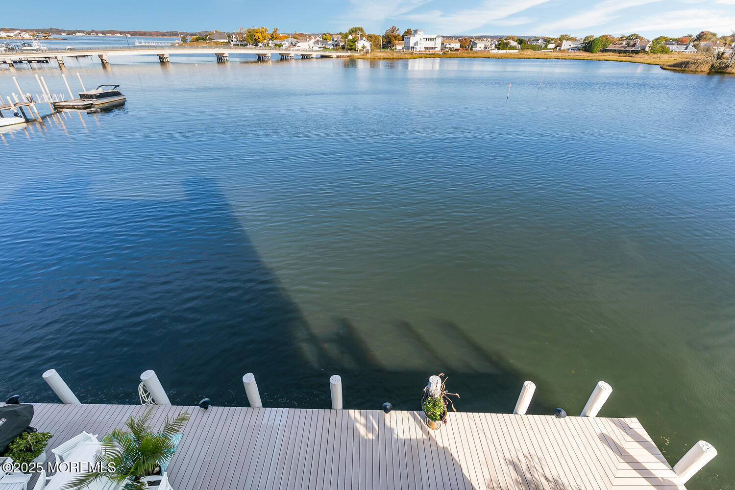 165 Riddle Avenue, Unit 7 Long Branch, NJ 07740 - Photo 80 of 87 a view of a balcony with wooden floor and lake view