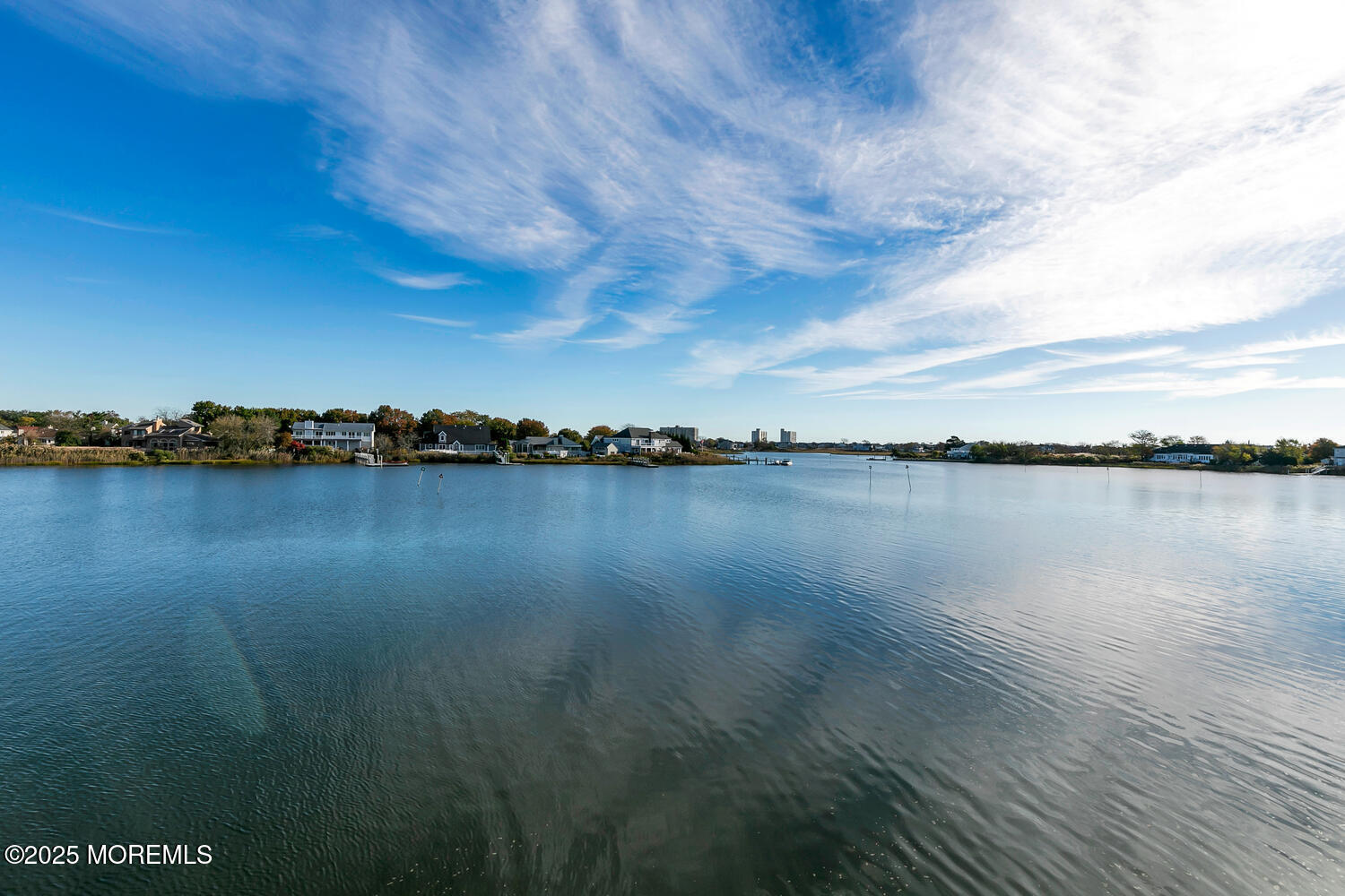 165 Riddle Avenue, Unit 7 Long Branch, NJ 07740 - Photo 84 of 87 a view of a lake with houses in the back